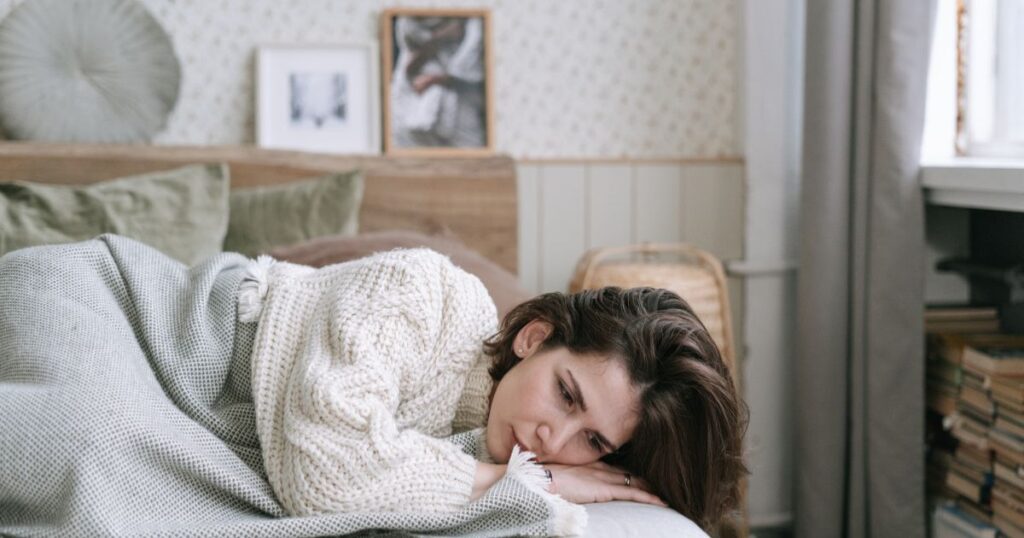 Woman feeling exhausted after sleeping during perimenopause